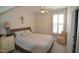 Bedroom with Queen bed, carpet, and shutters on the windows at 311 Silverhawk Ln, Durham, NC 27703