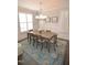 Elegant dining room with natural light, decorative lighting, and a stylish rug at 311 Silverhawk Ln, Durham, NC 27703