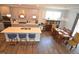 Inviting kitchen with island seating, stainless appliances, and open layout to dining and living areas at 311 Silverhawk Ln, Durham, NC 27703