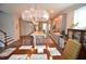 Open-concept kitchen featuring a large island, modern lighting, and seamless flow to the dining area at 311 Silverhawk Ln, Durham, NC 27703
