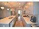 Contemporary kitchen with sleek cabinetry, a large island, and ample counter space at 311 Silverhawk Ln, Durham, NC 27703