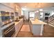 Gourmet kitchen with a center island, stainless steel appliances, and a seamless flow to the living spaces at 311 Silverhawk Ln, Durham, NC 27703