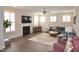 Bright living room features hardwood floors, a fireplace, and lots of natural light at 311 Silverhawk Ln, Durham, NC 27703
