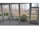 Screened porch overlooking green landscaping and trees at 311 Silverhawk Ln, Durham, NC 27703