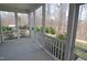 Screened porch overlooking green landscaping and trees at 311 Silverhawk Ln, Durham, NC 27703