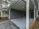 Carport area offering convenient covered parking and access to additional storage at 314 Mill Creek Dr, Fuquay Varina, NC 27526
