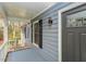 Close up of the home's front door and stylish exterior lighting at 314 Mill Creek Dr, Fuquay Varina, NC 27526