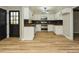 Updated kitchen featuring sleek countertops, stainless steel appliances, and ample cabinet space at 314 Mill Creek Dr, Fuquay Varina, NC 27526