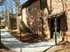 Brick house exterior with stairs to wooden deck, leading to backyard at 3217 Stoneyford Ct, Raleigh, NC 27603
