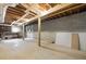 Unfinished basement with exposed rafters, block walls, and concrete floor at 3217 Stoneyford Ct, Raleigh, NC 27603