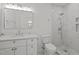 A modern bathroom with marble-style floors, a shower, and a white vanity at 3217 Stoneyford Ct, Raleigh, NC 27603