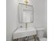 Modern bathroom featuring a stylish sink with gold accents and a sleek mirror at 3217 Stoneyford Ct, Raleigh, NC 27603