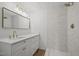 Bright bathroom featuring new vanity, upgraded shower, and modern fixtures at 3217 Stoneyford Ct, Raleigh, NC 27603