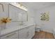 This modern bathroom features gold fixtures, white cabinets, and an abundance of natural light at 3217 Stoneyford Ct, Raleigh, NC 27603