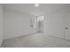 Bright bedroom with neutral carpet, a window with natural light, and closet with built-in shelving at 3217 Stoneyford Ct, Raleigh, NC 27603