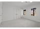 This bedroom has carpeting, base molding, and a closet with white bi-fold doors at 3217 Stoneyford Ct, Raleigh, NC 27603