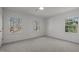 This bedroom features three windows that provide natural light and scenic outdoor views at 3217 Stoneyford Ct, Raleigh, NC 27603