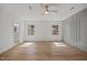 Bedroom featuring hardwood floors, natural light, and a doorway to the attached bath at 3217 Stoneyford Ct, Raleigh, NC 27603