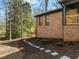 Brick home with a charming stone walkway and lovely landscaping at 3217 Stoneyford Ct, Raleigh, NC 27603