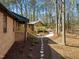 Brick home with walkway leading to the main house and additional building at 3217 Stoneyford Ct, Raleigh, NC 27603