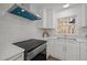 Close up of stainless steel appliances, modern white subway tile and white quartz countertops at 3217 Stoneyford Ct, Raleigh, NC 27603