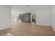 Open and airy living area showcasing hardwood floors and a stylish accent wall at 3217 Stoneyford Ct, Raleigh, NC 27603