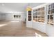 Spacious living room featuring hardwood floors, an open floor plan, and a wall of windows at 3217 Stoneyford Ct, Raleigh, NC 27603