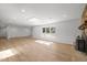 Bright and airy living area featuring hardwood floors, a skylight, a fireplace, and modern lighting at 3217 Stoneyford Ct, Raleigh, NC 27603