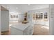 Open concept living area featuring hardwood floors, fireplace, and a kitchen island at 3217 Stoneyford Ct, Raleigh, NC 27603