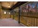 Covered back patio with brick flooring and wooden railing, offering scenic views at 3217 Stoneyford Ct, Raleigh, NC 27603