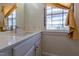 Bathroom featuring a vanity with a modern faucet and bright natural light at 347 W Trade St, Burlington, NC 27217