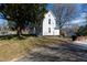 Classic white two-story home with a spacious yard and inviting front porch at 347 W Trade St, Burlington, NC 27217