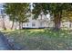 Beautiful two story home showcasing a welcoming front porch and mature trees at 347 W Trade St, Burlington, NC 27217
