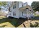Charming home featuring an inviting front porch with classic white railings and supporting pillars at 347 W Trade St, Burlington, NC 27217