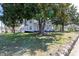 Charming two-story white home enhanced by mature trees, providing ample shade at 347 W Trade St, Burlington, NC 27217