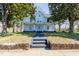 Inviting two-story home with a charming front porch and well-manicured landscaping at 347 W Trade St, Burlington, NC 27217