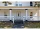 Welcoming front porch with classic white railings and columns, creating an inviting entrance to the home at 347 W Trade St, Burlington, NC 27217