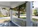 Relaxing front porch view showing white railings and columns, offering a serene outdoor living space with views of street at 347 W Trade St, Burlington, NC 27217