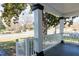 View from front porch showing white railings and columns, offering a serene outdoor living space with views of street at 347 W Trade St, Burlington, NC 27217