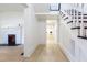 Hallway featuring wood-look floors, stairs, and access to other rooms at 347 W Trade St, Burlington, NC 27217