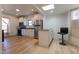Updated kitchen features stainless steel appliances, white cabinetry, and a breakfast bar at 347 W Trade St, Burlington, NC 27217