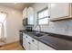 Close-up of kitchen showcasing sink, countertops, and stainless steel appliances at 347 W Trade St, Burlington, NC 27217