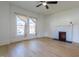 Living room showcasing new floors, fireplace and natural light at 347 W Trade St, Burlington, NC 27217