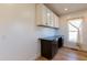 Bright office with natural light features modern desk and white cabinetry at 347 W Trade St, Burlington, NC 27217