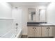 Clean bathroom with tiled shower and tub, dual mirrors, and a sleek vanity at 349 Tristen Ln, Henderson, NC 27537