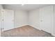 A carpeted bedroom has natural light and two closets at 349 Tristen Ln, Henderson, NC 27537