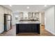 Modern kitchen featuring stainless steel appliances, a center island, and stylish finishes, perfect for cooking at 349 Tristen Ln, Henderson, NC 27537