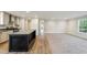 Open layout featuring kitchen with island, adjoining living room with lots of space at 349 Tristen Ln, Henderson, NC 27537