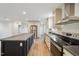 A modern kitchen with stainless steel appliances and a large island at 349 Tristen Ln, Henderson, NC 27537