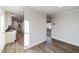 View of the kitchen from the living area with hardwood floors at 349 Tristen Ln, Henderson, NC 27537